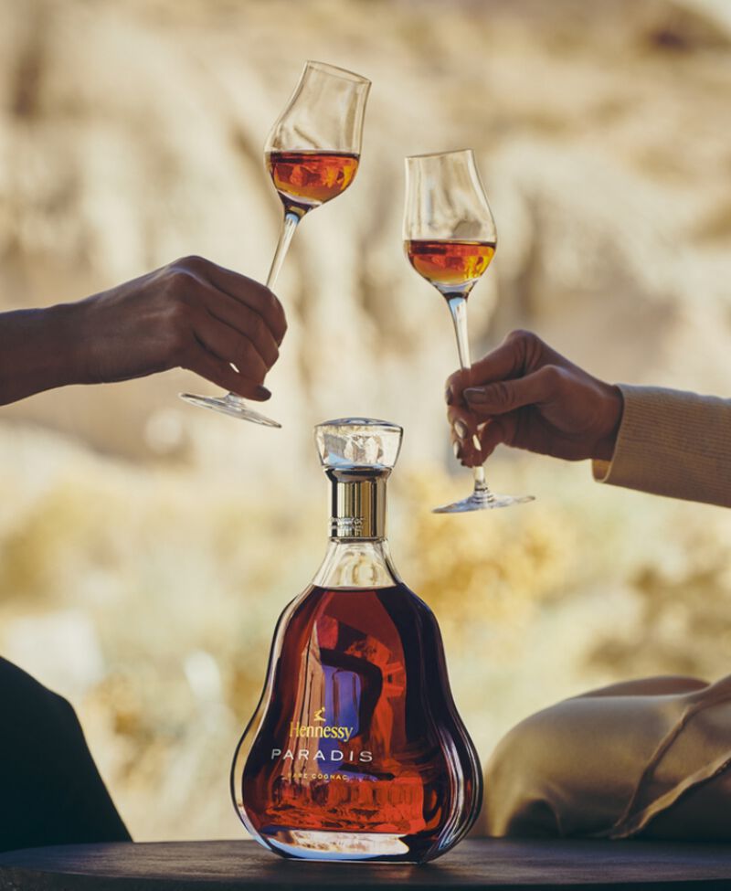 Bottle of Hennessy Paradis being enjoyed by two people