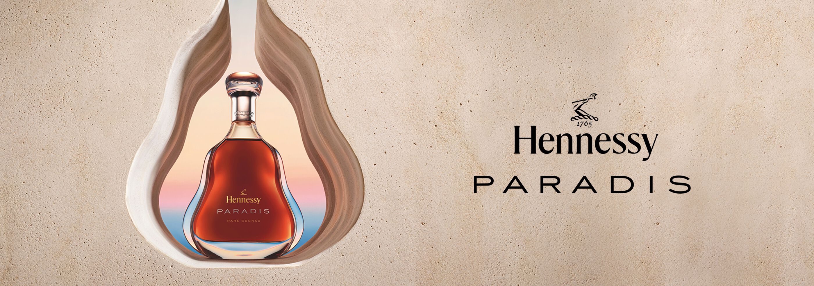 Hennessy Paradis bottle in rock wall cutout