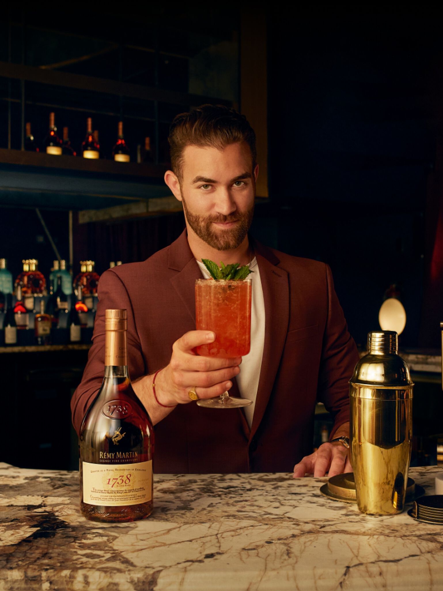 A gentleman enjoying cocktails made with Remy Martin