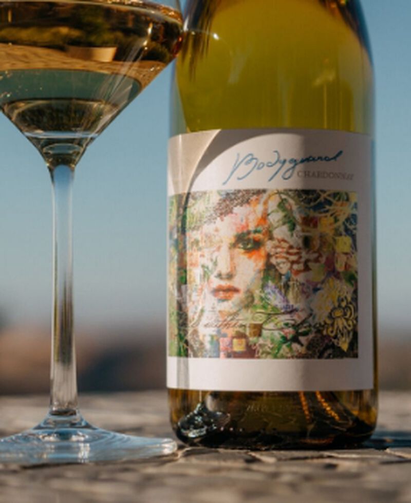 Bottle of DAOU Vineyard 'Bodyguard' Santa Barbara Chardonnay with a glass
