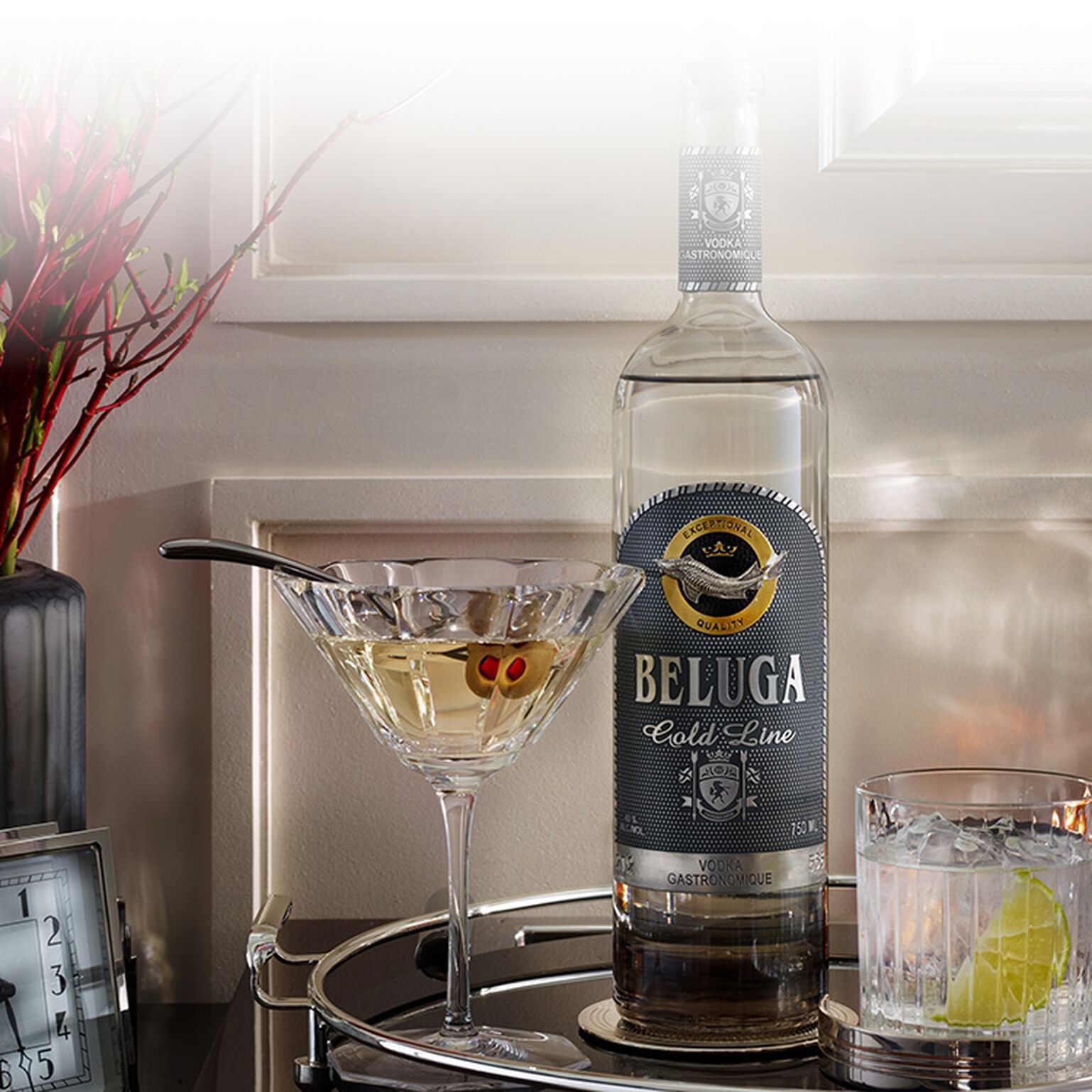  Bottle of Beluga Gold Line Vodka with cocktail tools and martini glasses