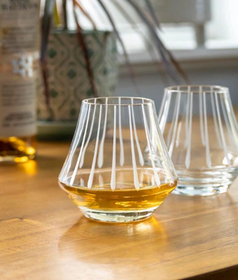 Two Rolf Modern Whisky Tasting Glasses with whiskey in one of them