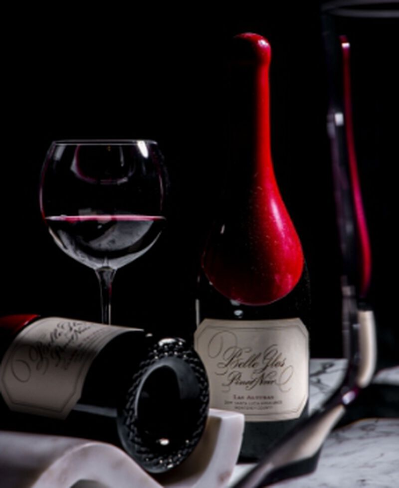 Bottle of Belle Glos 'Los Alturas Vineyard' Santa Lucia Highlands Pinot Noir with a filled wine glass