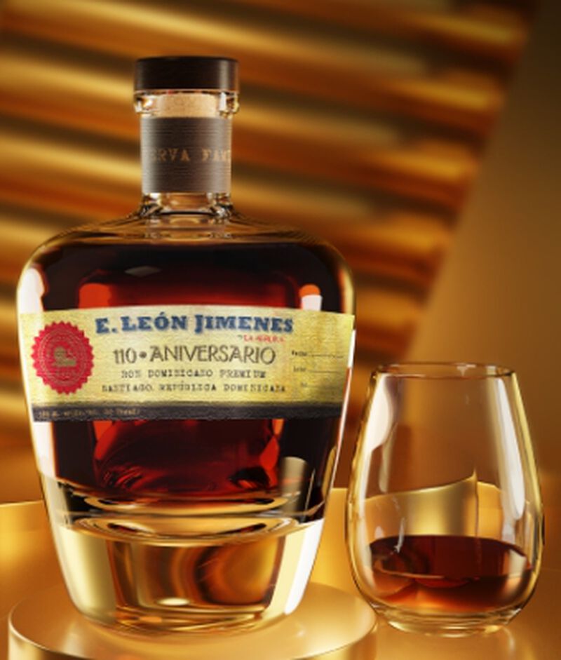 Bottle of E. León Jimenes Rum with a glass