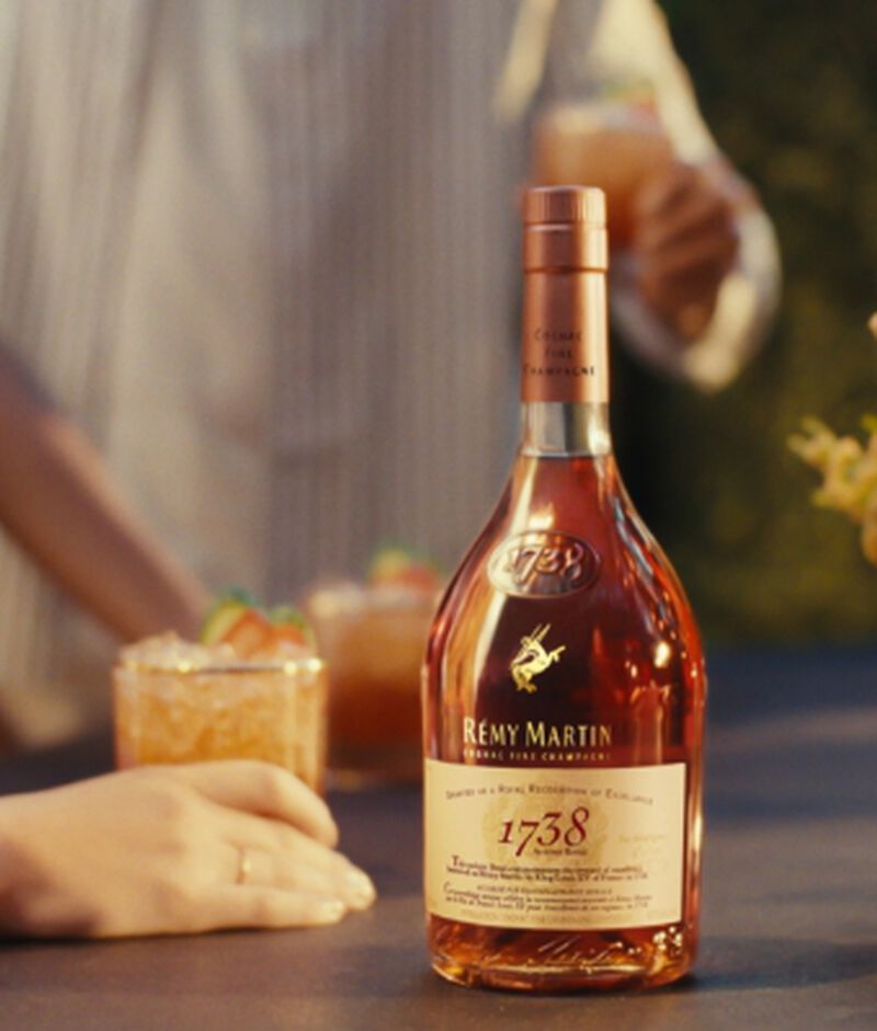 A bottle of Rémy Martin 1738 Accord Royal End Of Year Limited Edition with a cocktail