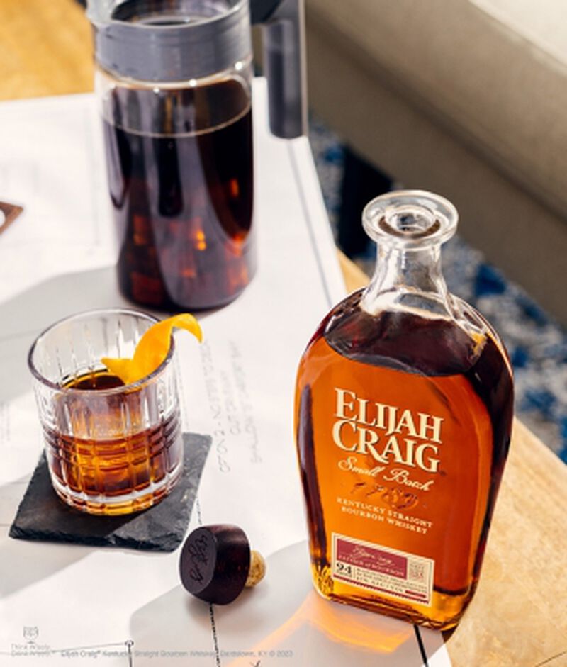 Bottle of Elijah Craig Small Batch with a cocktail