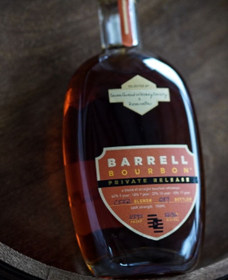 Bottle of Barrell Craft Spirits Seven Grand Private Release Bourbon C52R laying on wood