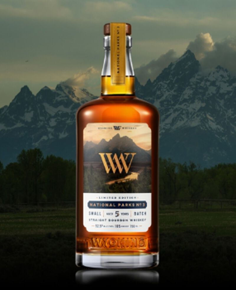 Bottle of Wyoming Whiskey National Parks No.3 in front of mountains