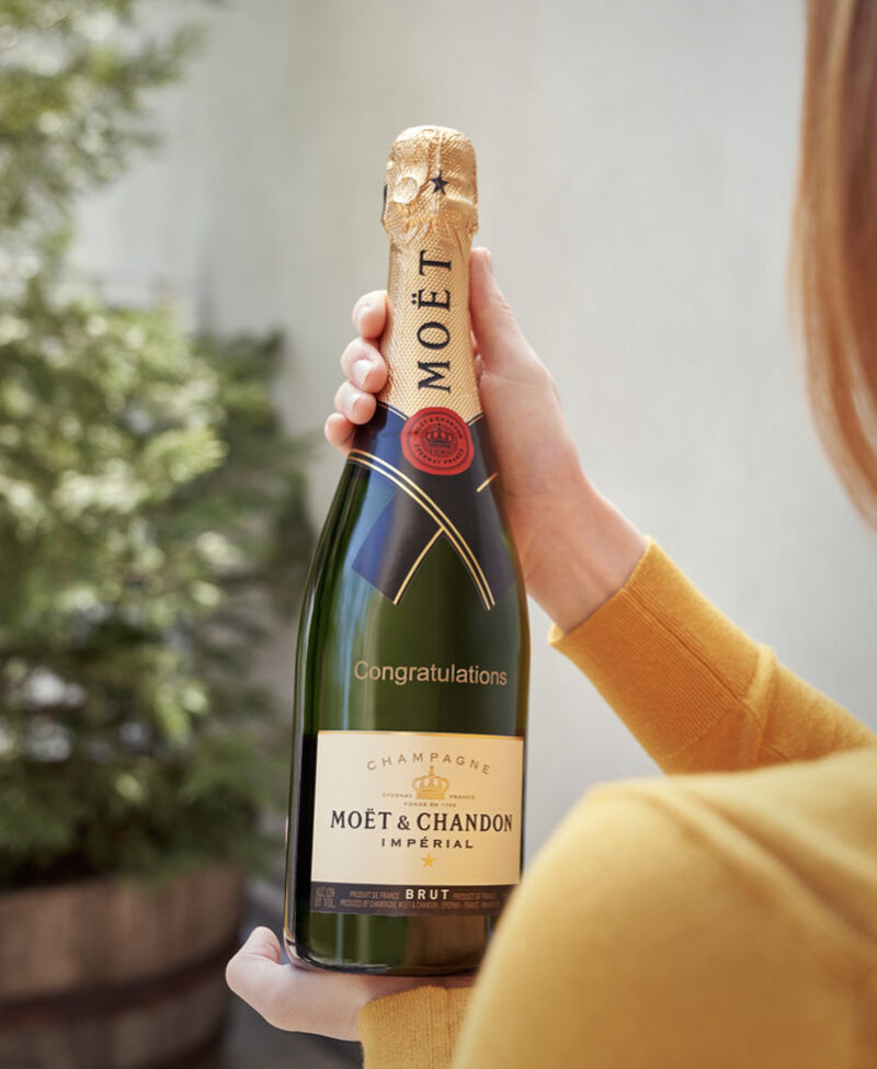 Bottle of Moet Champagne engraved with "Congratulations"