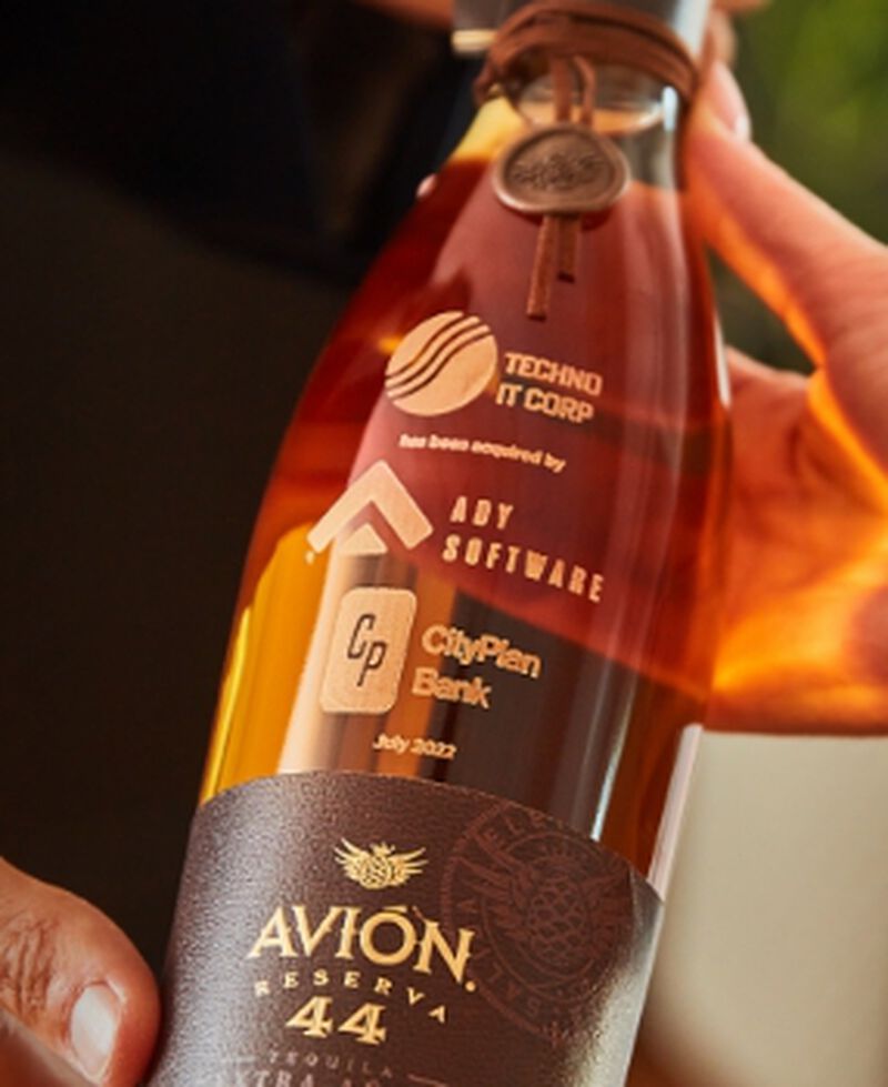 A bottle of Avion Tequila with custom engraving - perfect for corporate gifting!