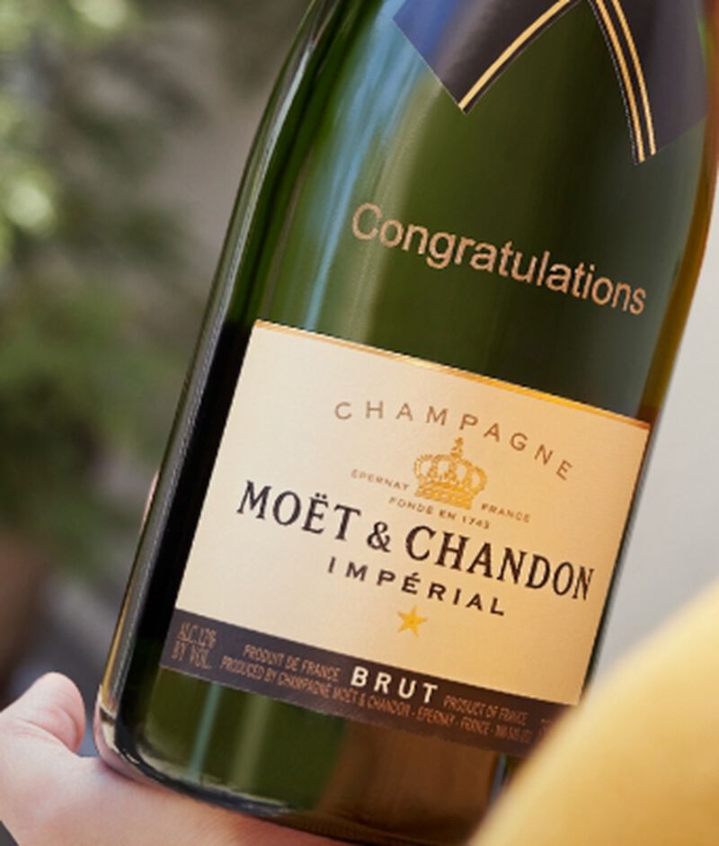 Bottle of Moet Champagne with "congratulations" engraved on the bottle