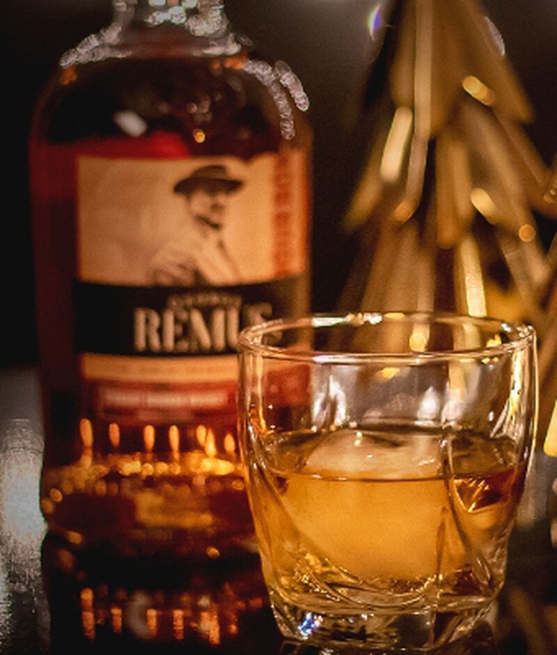 Bottle of George Remus Bourbon with a rocks glass