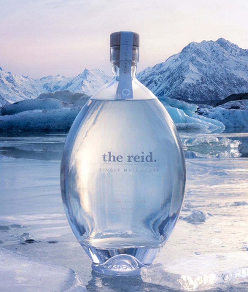 Bottle of The Reid Single Malt Vodka in front of icy glaciers