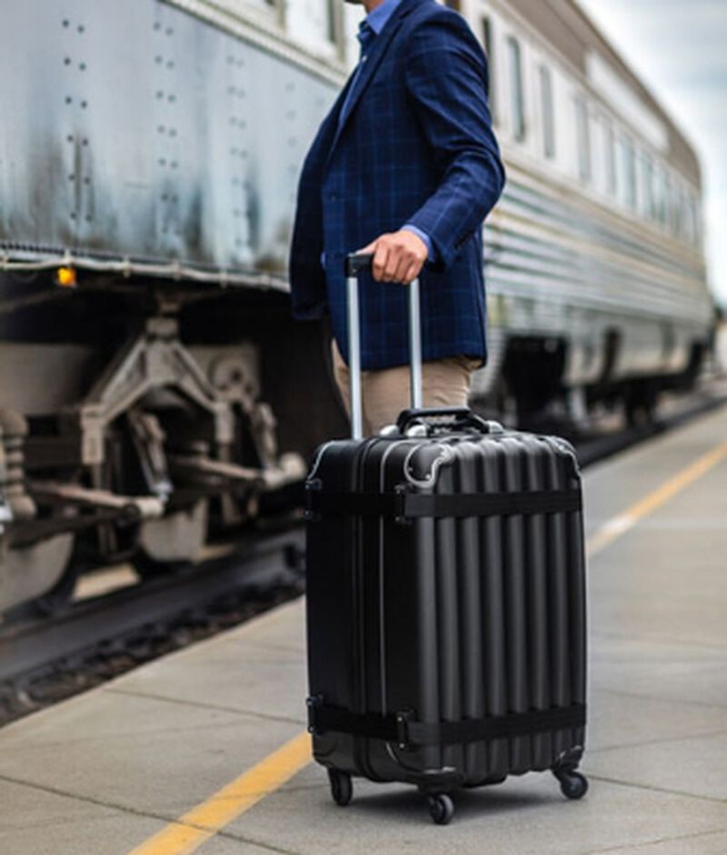 A man using the VinGardeValise® All-Purpose Suitcase Black