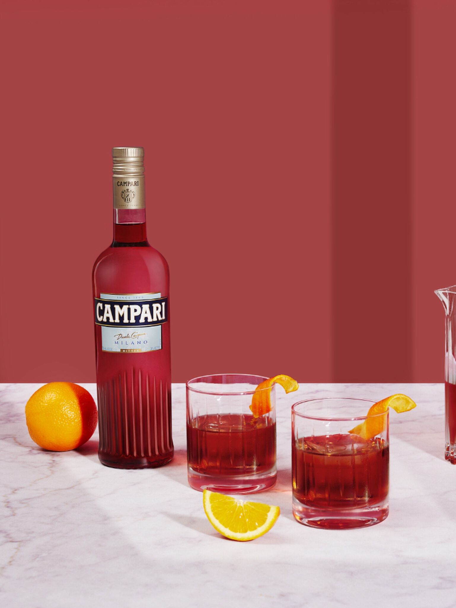 A bottle of Campari with cocktails