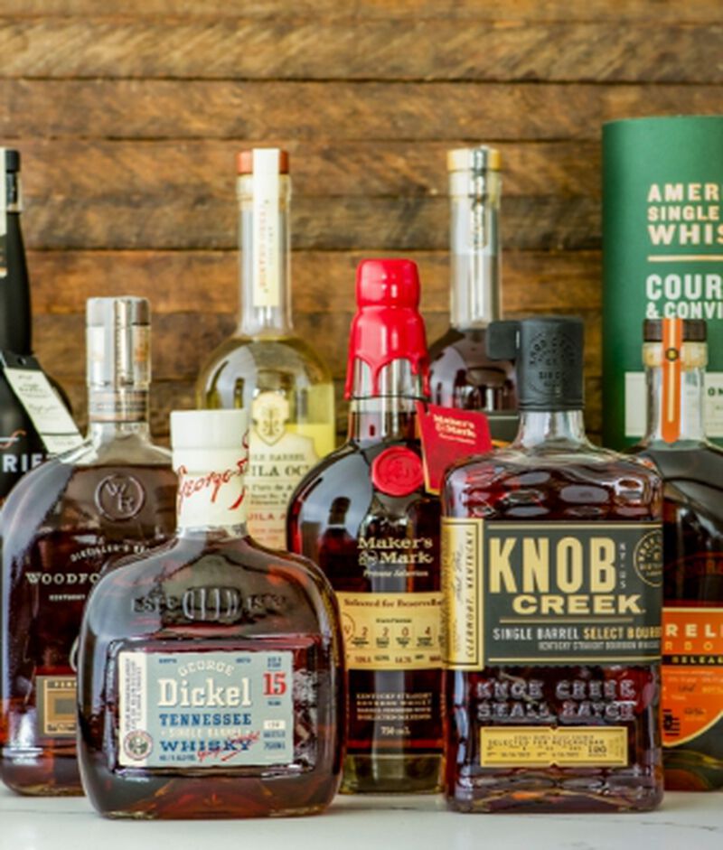 A collection of single barrel whiskey bottles