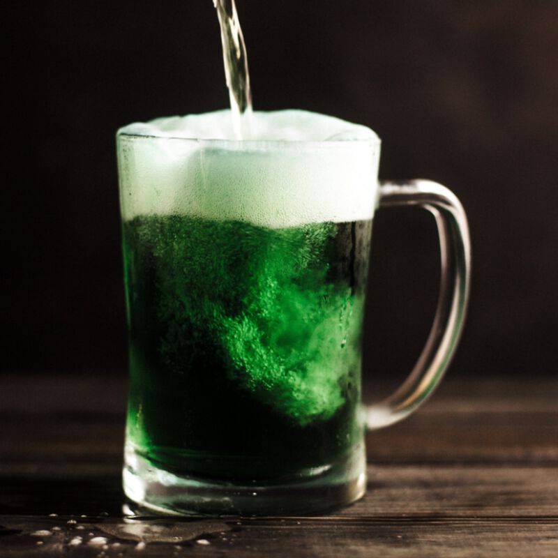 A mug full of a green drink
