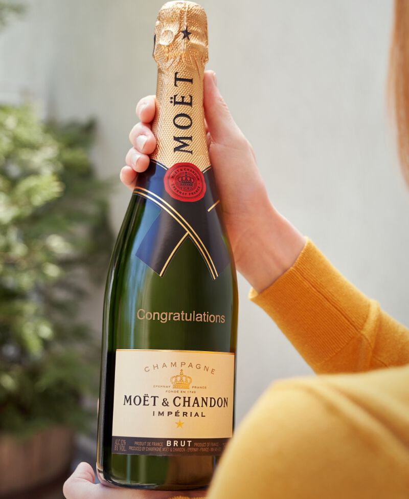 Bottle of Champagne engraved with "Congratulations"