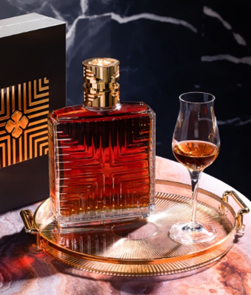 Bottle of Camus Cognac XO Prestige Decanter with a glass