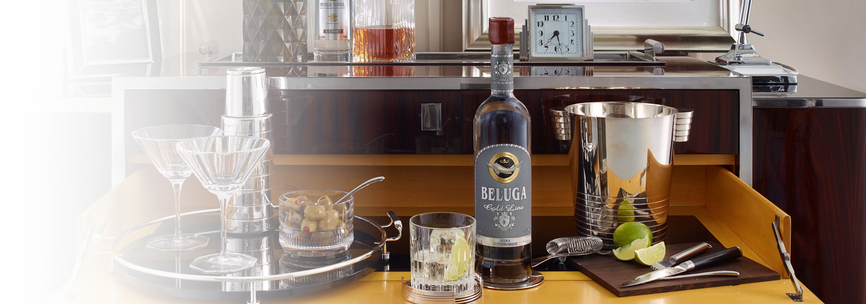  Bottle of Beluga Gold Line Vodka with cocktail tools and martini glasses