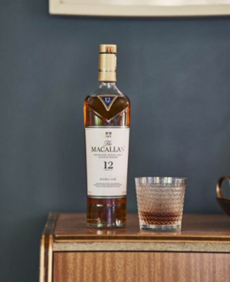 A bottle of The Macallan Double Cask 12 Years Old with a cocktail