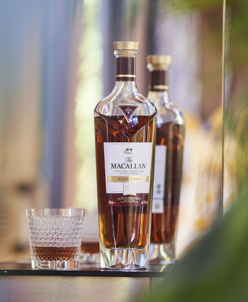 A bottle of The Macallan Rare Cask Single Malt Whiskey with glasses